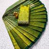 A "one gram gold trending tissue saree" typically refers to a saree made from a lightweight, sheer fabric known as tissue - DARK GREEN