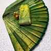 A "one gram gold trending tissue saree" typically refers to a saree made from a lightweight, sheer fabric known as tissue - GREEN