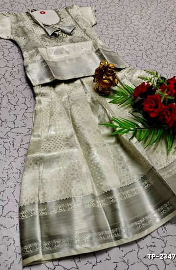 FESTIVAL AND FUNCTION WEAR TRADITIONAL KIDS PATTU PAVADAI STONE WORK DESIGN - WHITE