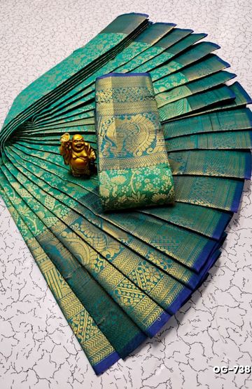 A "one gram gold trending tissue saree" typically refers to a saree made from a lightweight, sheer fabric known as tissue - EMERALD COLOUR (4)