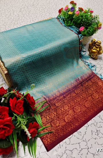A "one gram gold trending tissue saree" typically refers to a saree made from a lightweight, sheer fabric known as tissue - INDIGO COLOUR (3)