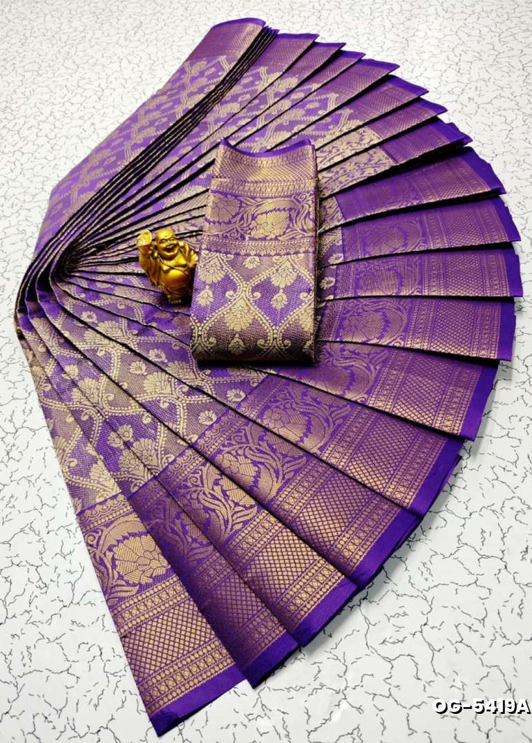 A "one gram gold trending tissue saree" typically refers to a saree made from a lightweight, sheer fabric known as tissue - LAVENDER DARK