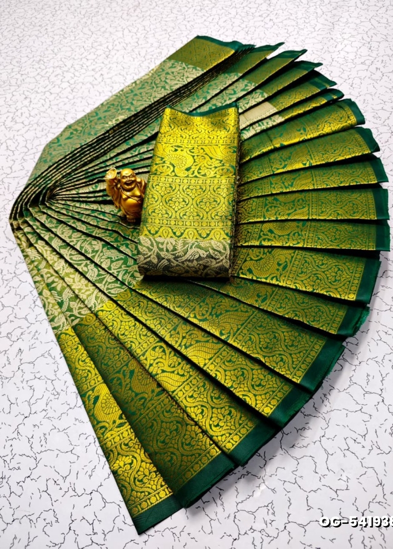 A "one gram gold trending tissue saree" typically refers to a saree made from a lightweight, sheer fabric known as tissue - DARK GREEN