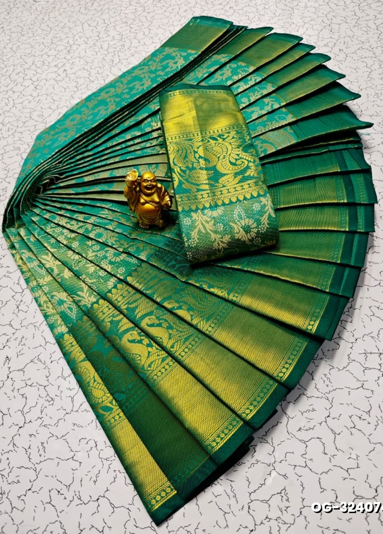 A "one gram gold trending tissue saree" typically refers to a saree made from a lightweight, sheer fabric known as tissue - EMERALD COLOUR (2)