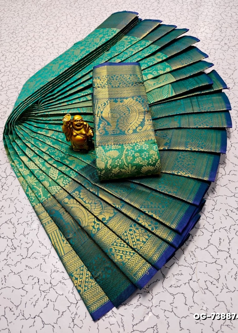 A "one gram gold trending tissue saree" typically refers to a saree made from a lightweight, sheer fabric known as tissue - EMERALD COLOUR (4)