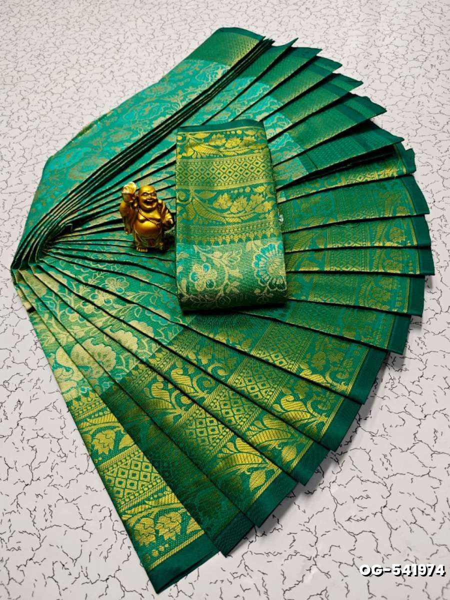 A "one gram gold trending tissue saree" typically refers to a saree made from a lightweight, sheer fabric known as tissue - EMERALD COLOUR