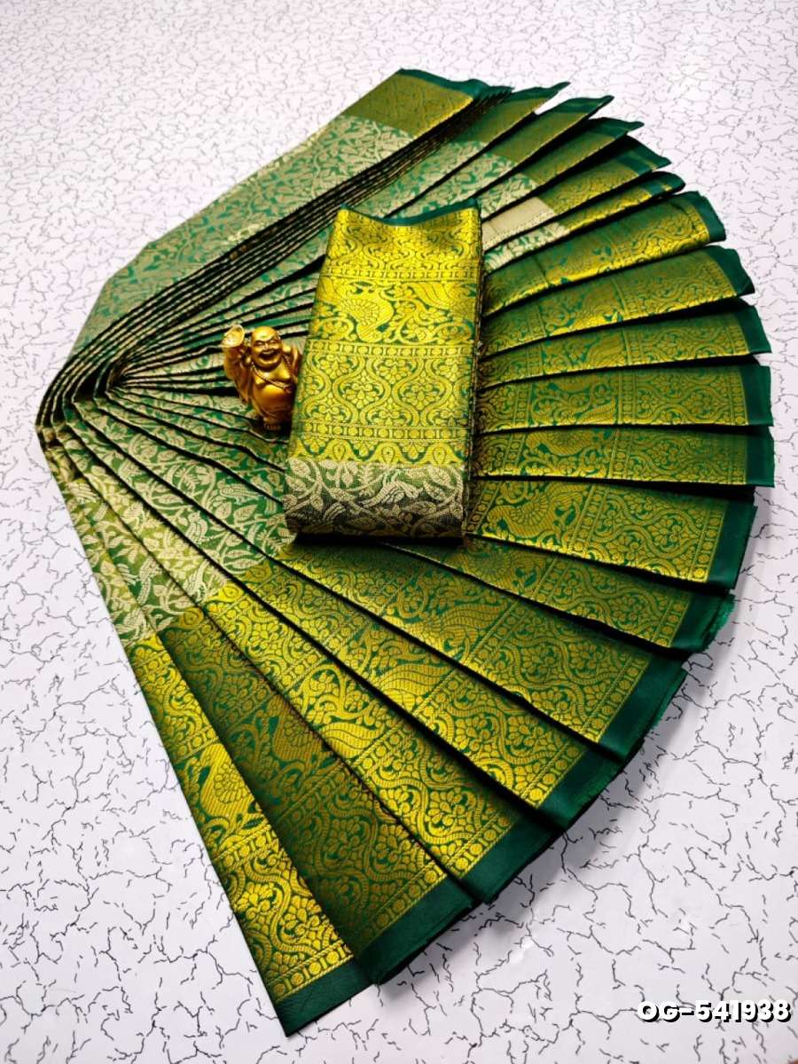 A "one gram gold trending tissue saree" typically refers to a saree made from a lightweight, sheer fabric known as tissue - DARK GREEN